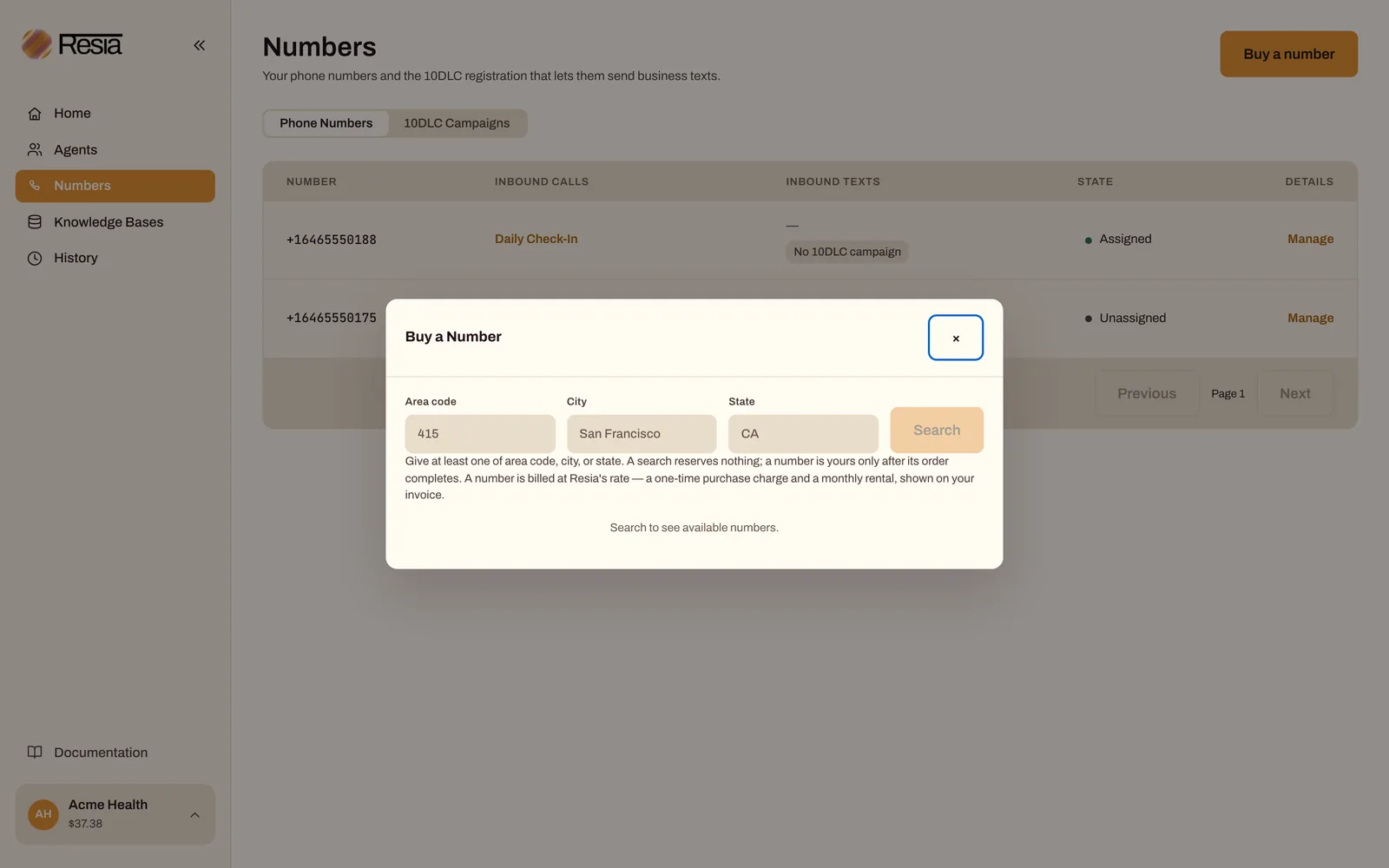 The Buy a Number dialog in the portal, with area code, city, and state fields